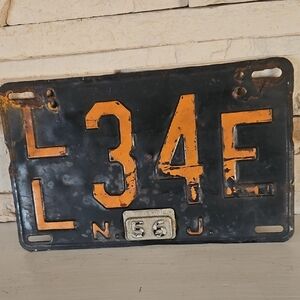 Vintage 1956 New Jersey Steel License Plate. Black and Orange License Plate